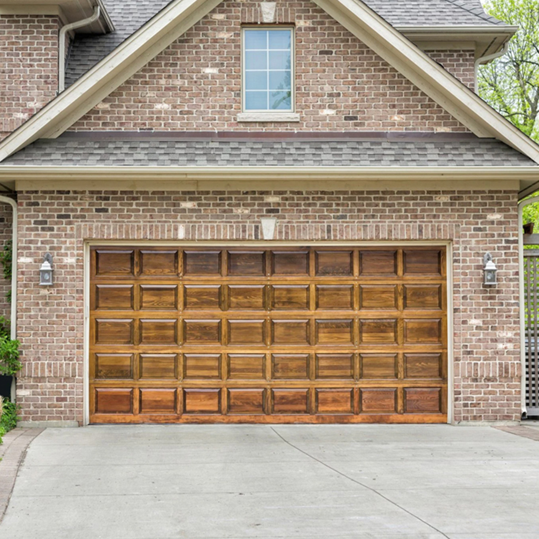 brown-wood-garage-door-installation-modern-brick-home