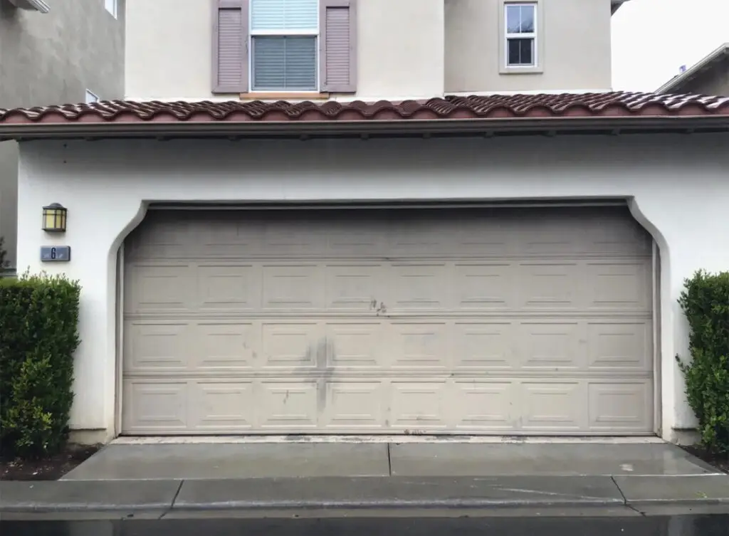 white home tan garage door panel repair